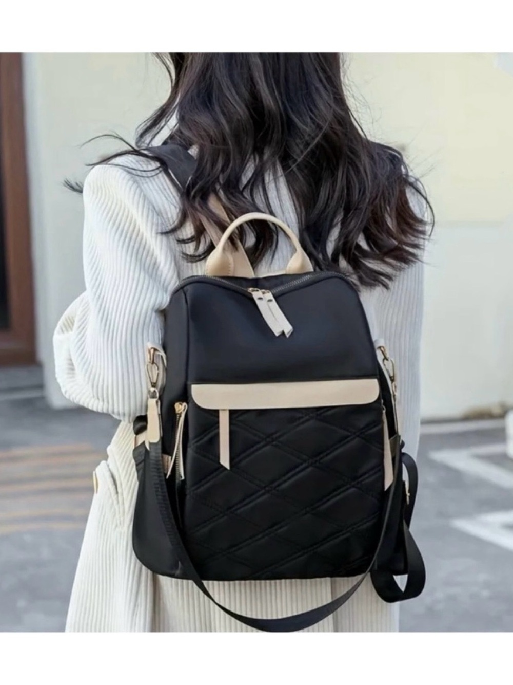 Elegant Black Quilted Backpack with Cream Trim